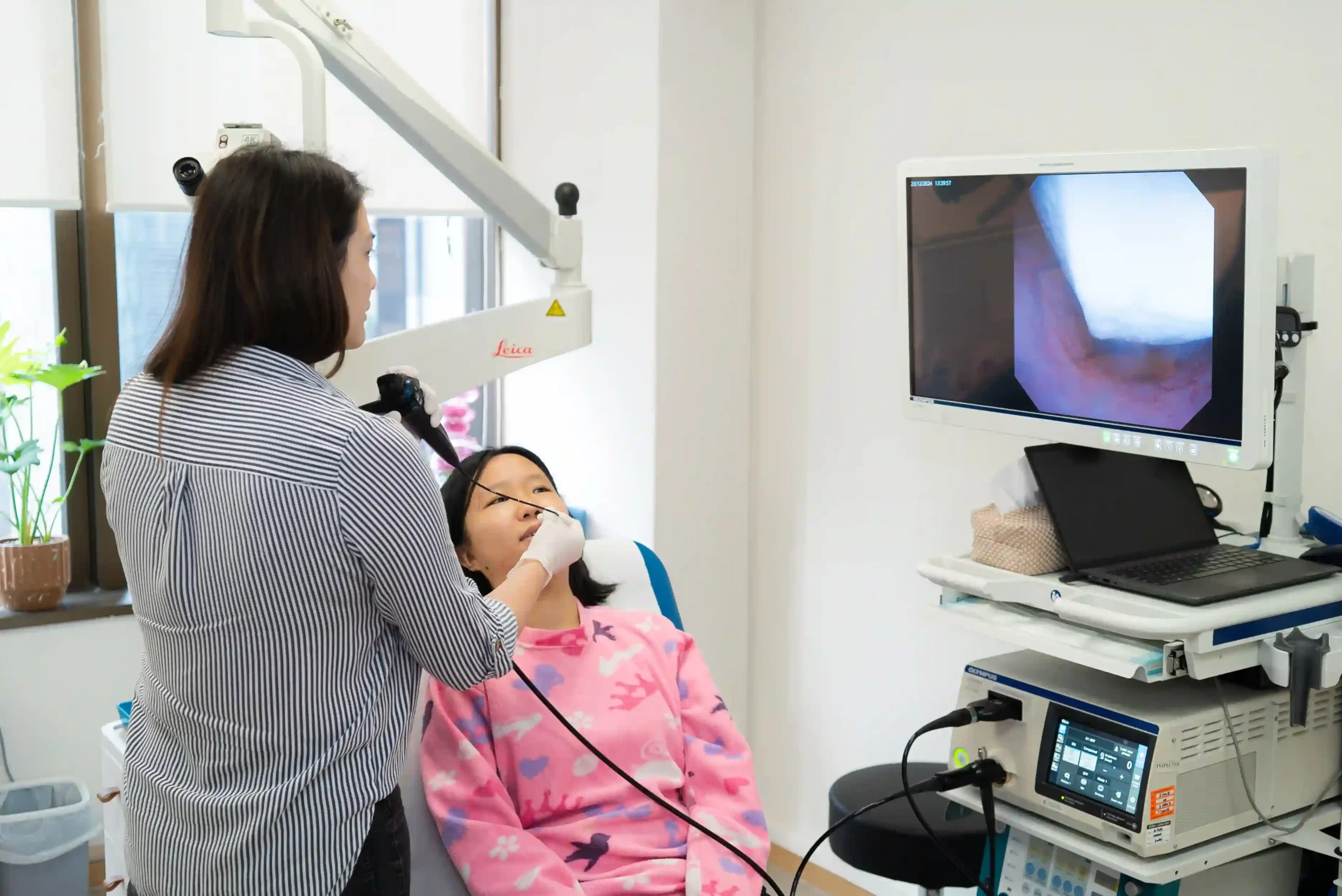 dr ker liang inspecting a patient's nasal passages