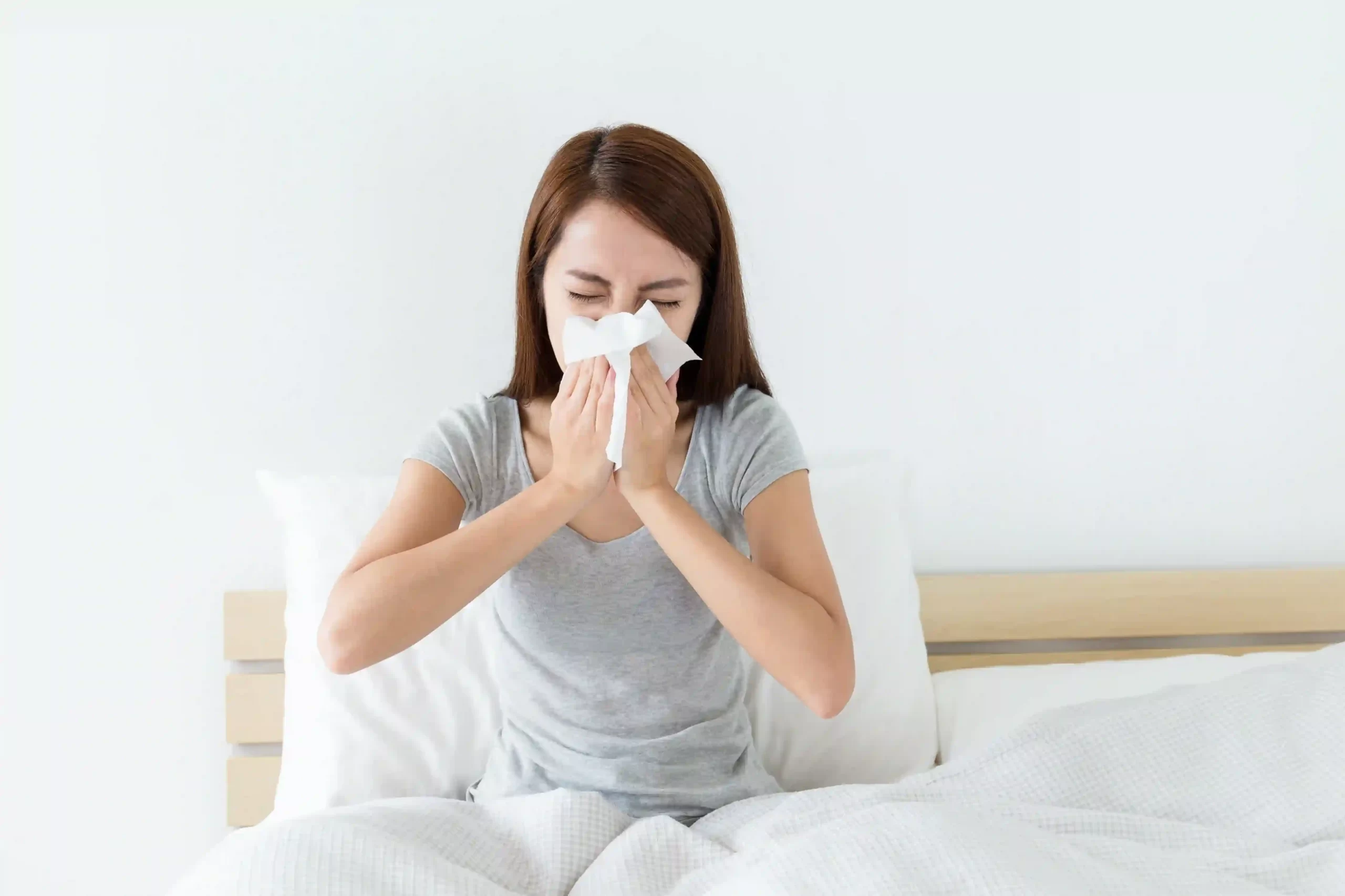 lady having a runny nose after waking up