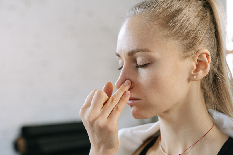 a woman doing nostril breathing